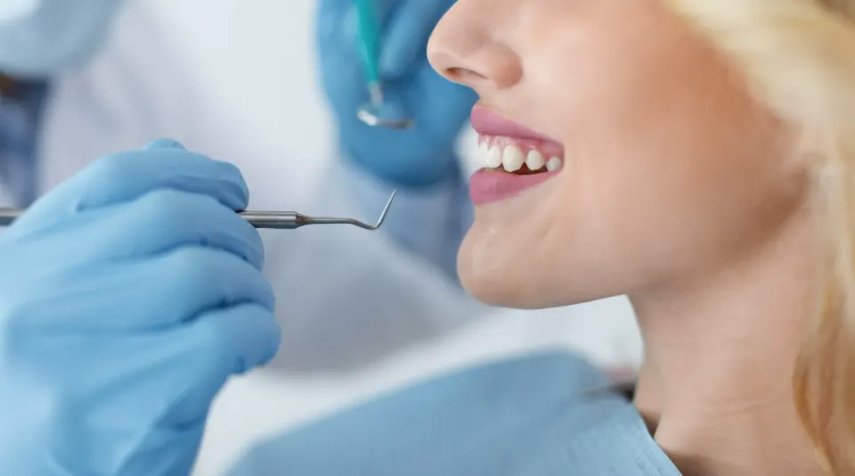 Dr. Sheetal Manmode examining a dental implant patient at Dental World in Longwood FL