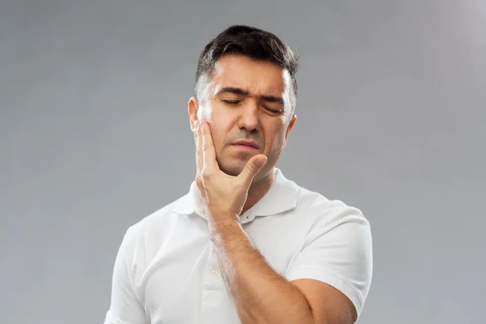 Close-up educational illustration of healthy versus inflamed gum tissue at Dental World Longwood