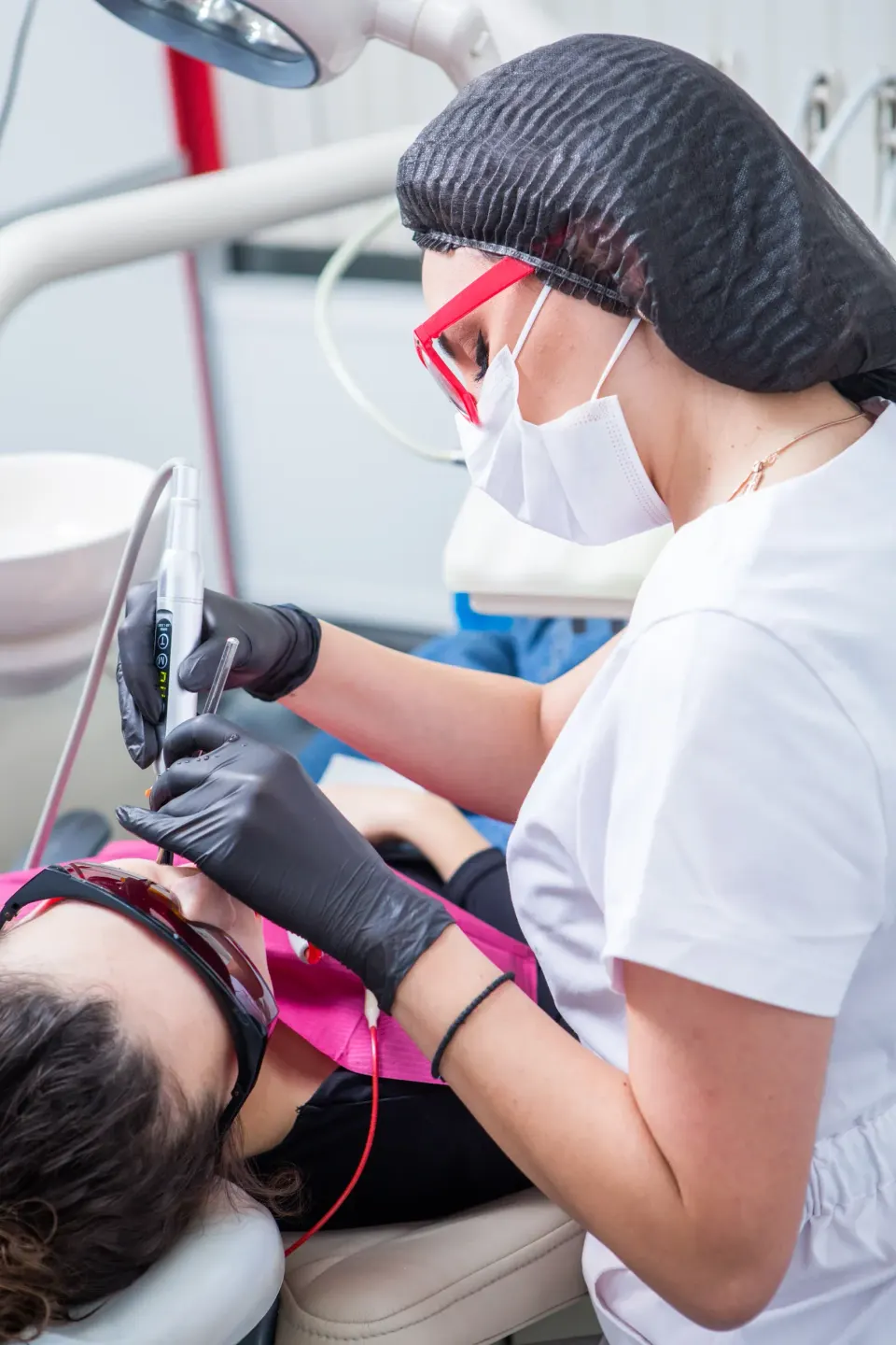 Person experiencing jaw pain from teeth grinding at Dental World Longwood