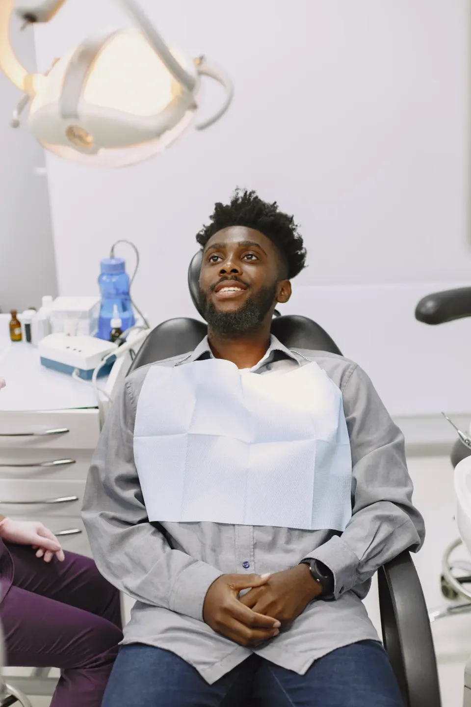 Person concerned about gum health at Dental World Longwood FL