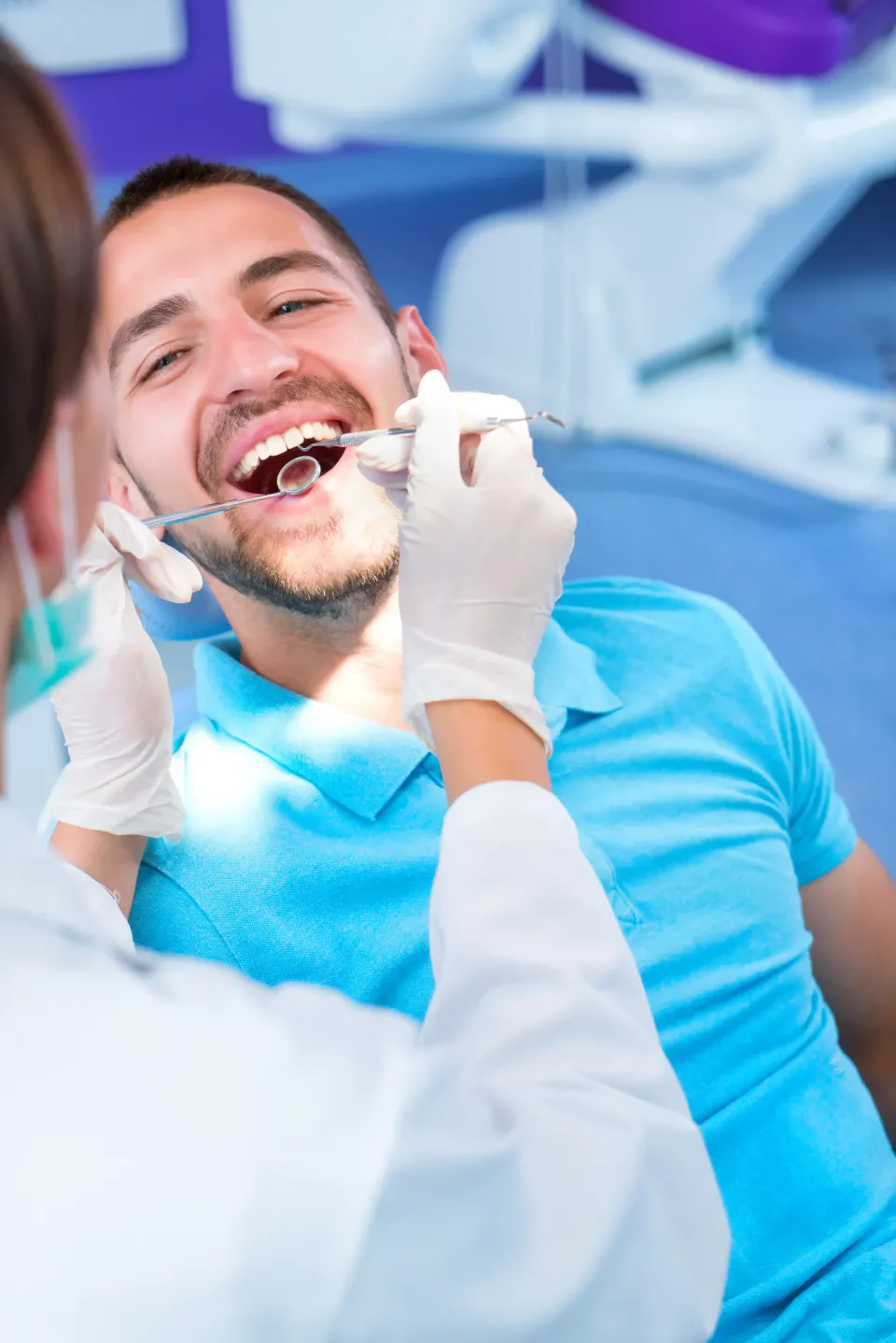 Patient consulting Dr. Manmode about metal-free zirconia implant benefits in Longwood FL