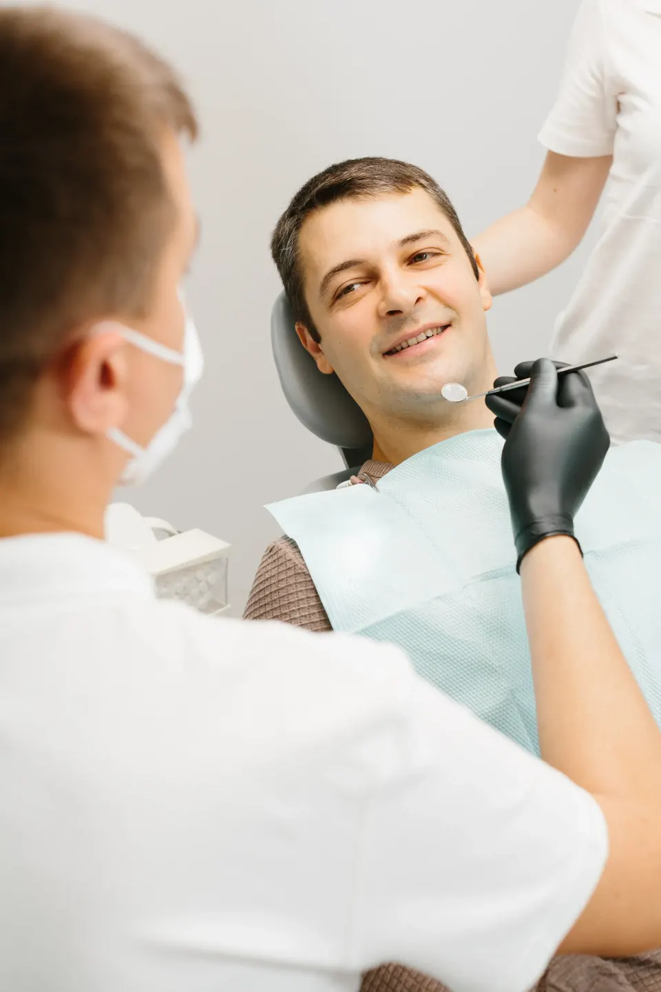 Confident patient portrait after metal-free zirconia dental implant care in Longwood Florida
